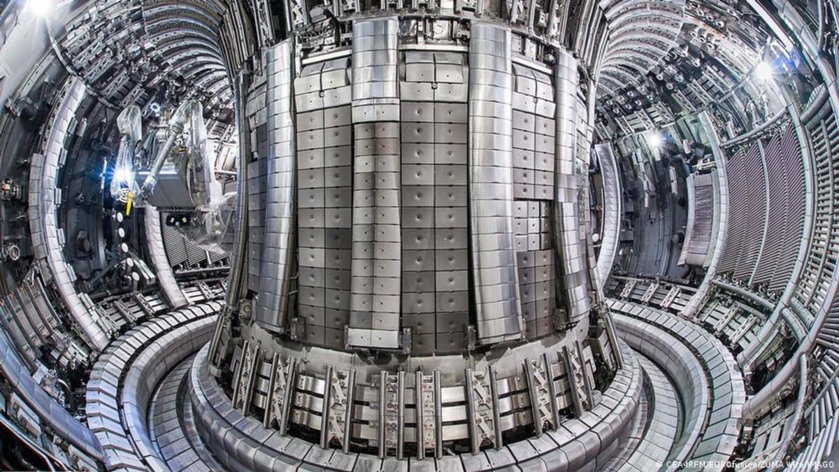 Glowing plasma inside experimental nuclear fusion reactor chamber showing clean energy breakthrough