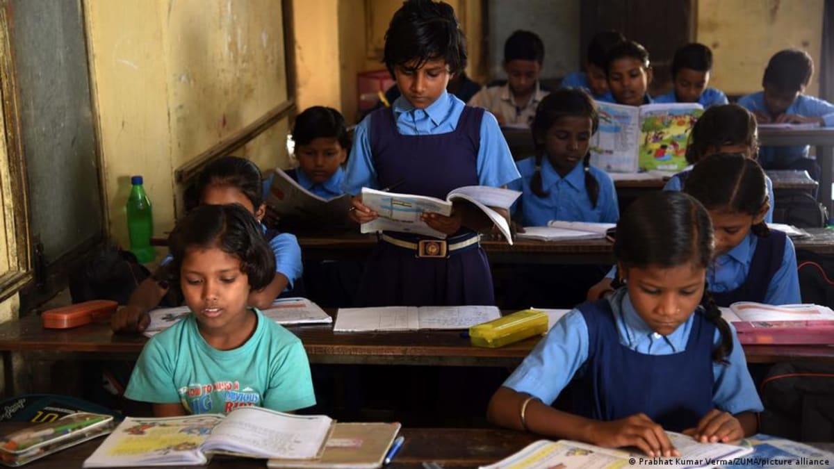 Students sitting in simple classroom in rural Maharashtra village school in India