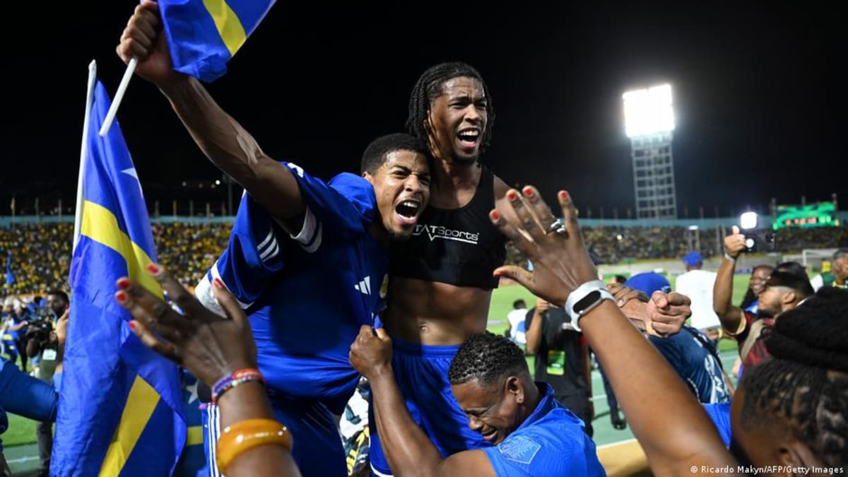 Curacao national football team players celebrating their historic World Cup qualification together on field