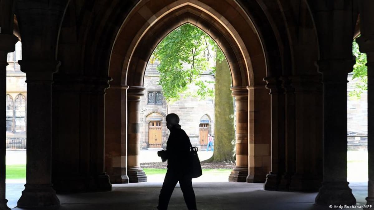 Students with backpacks walking together on European university campus, representing international education exchange opportunities