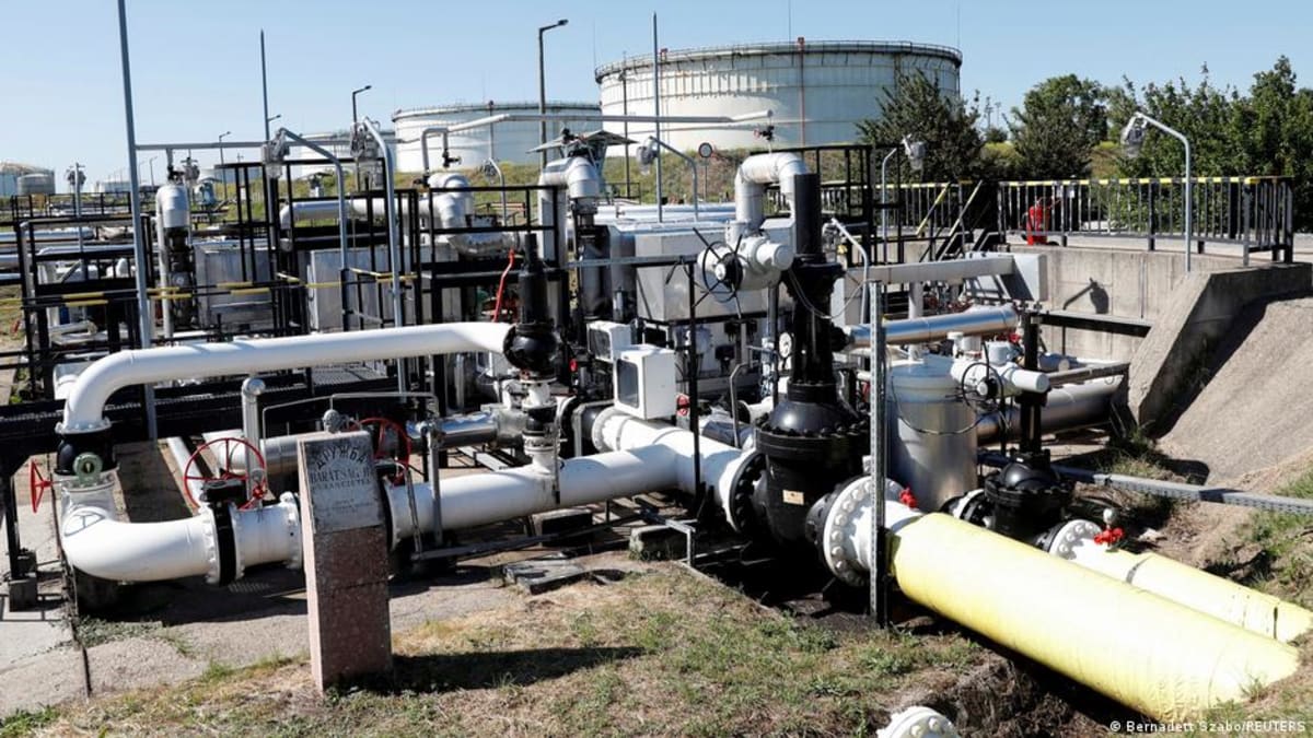 Industrial oil pipeline stretching across open landscape in Ukraine