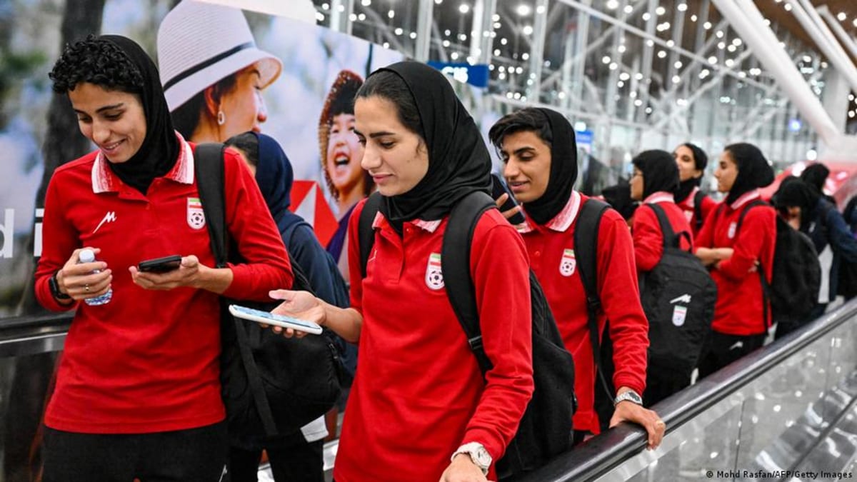 Iranian women's national football team members arriving at airport in Malaysia after tournament