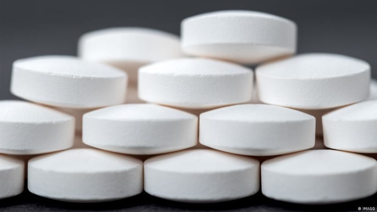 Pharmacy shelves stocked with medicine bottles representing improved European pharmaceutical supply chains