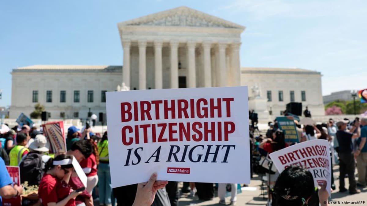 Protesters gathered outside the US Supreme Court building holding signs during oral arguments