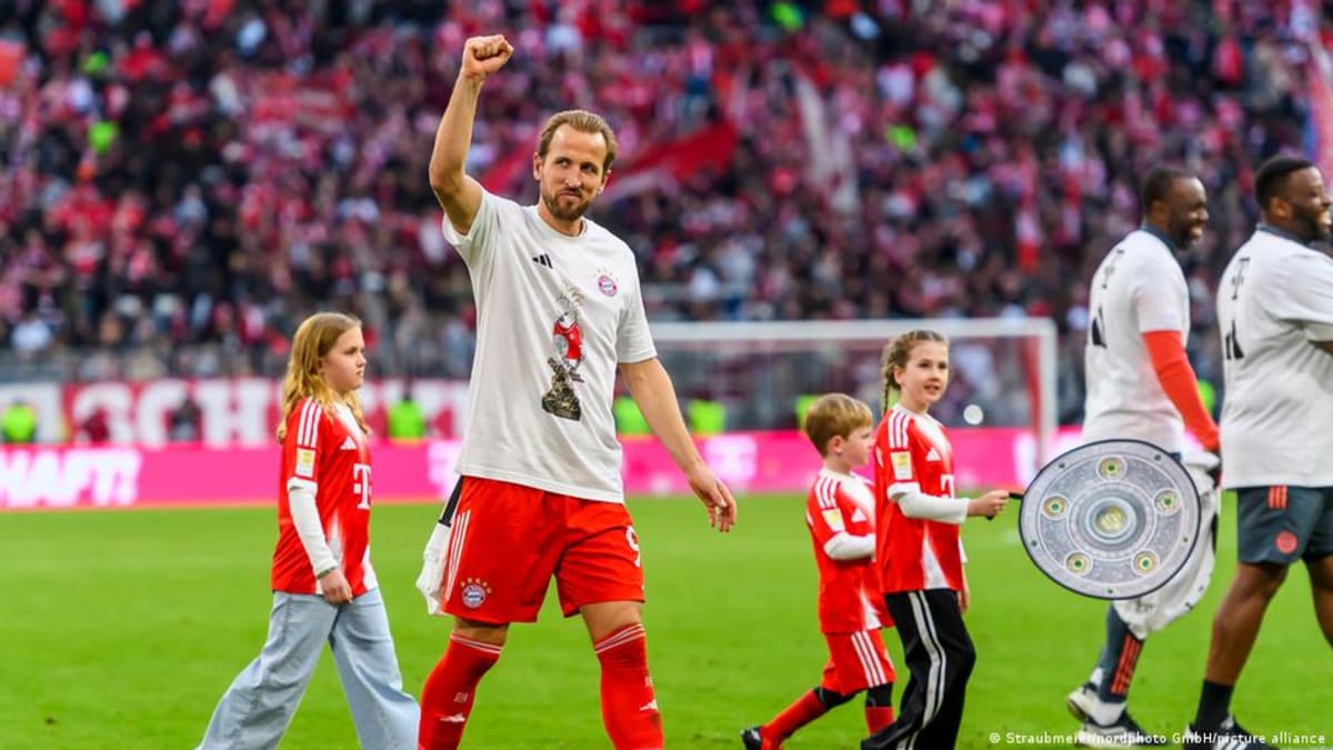 Vincent Kompany celebrating with Bayern Munich players after clinching the Bundesliga championship title