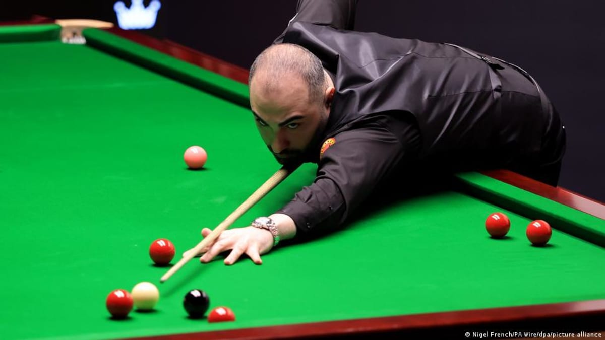 Hossein Vafaei playing snooker at professional tournament in Sheffield England