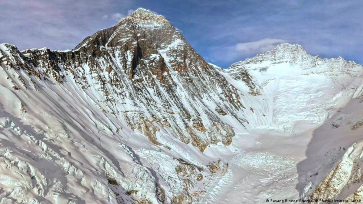 Kami Rita Sherpa standing with climbing gear near Mount Everest base camp
