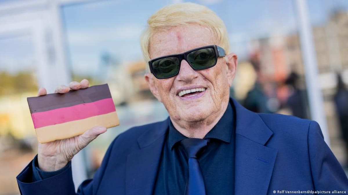** Elderly German singer Heino wearing signature black sunglasses and blonde hair at public event