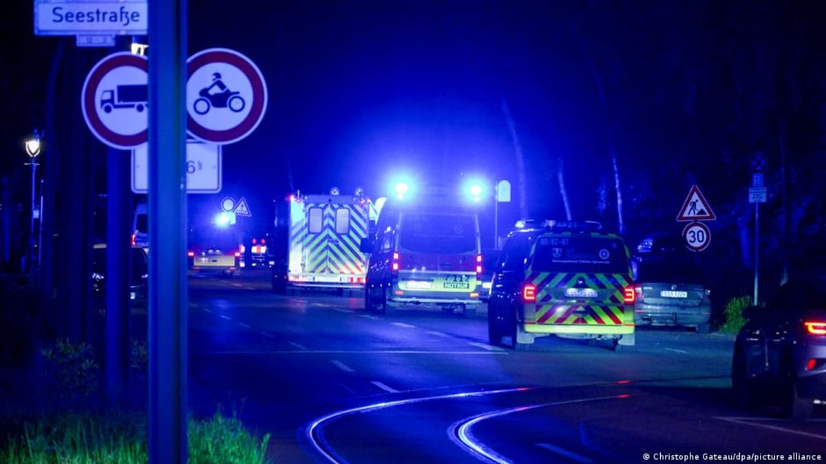 ** Specialized medical ambulance arriving at Berlin's Charité hospital isolation unit at night