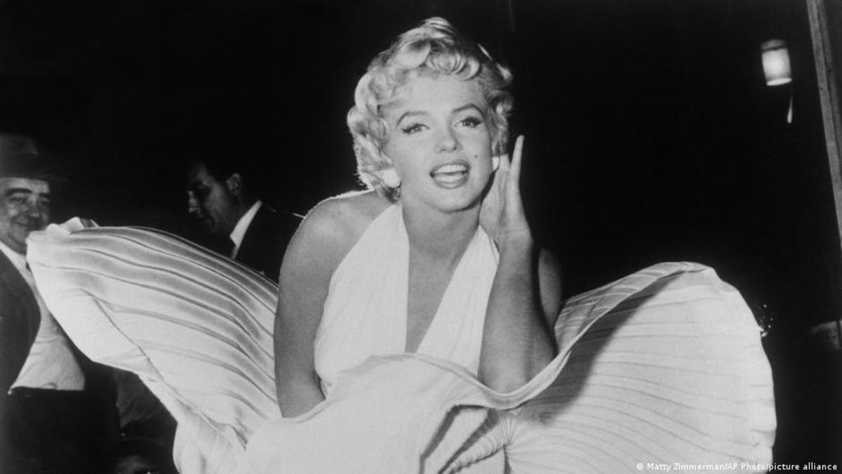 ** Marilyn Monroe reading James Joyce's Ulysses on a playground in 1955, photographed by Eve Arnold