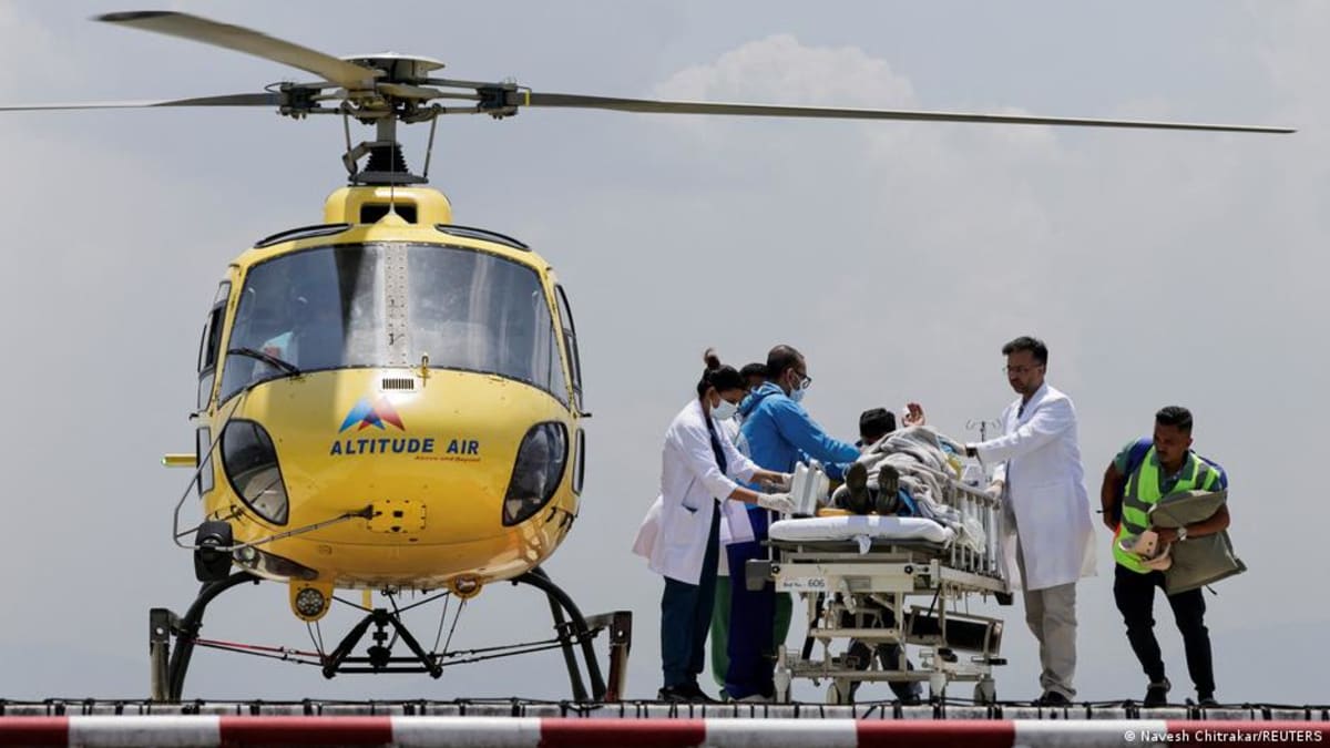 Rescue team transporting Dawa Sherpa by helicopter to Kathmandu hospital after Mount Everest survival