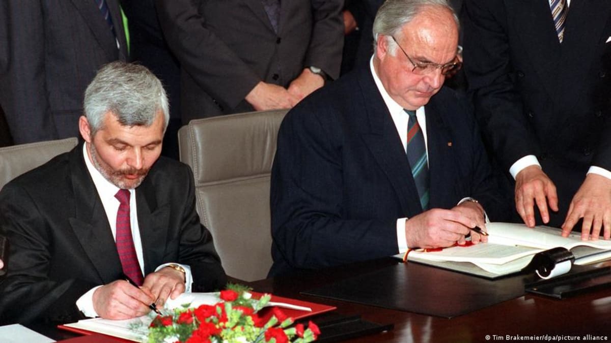 ** German Chancellor Helmut Kohl and Polish Prime Minister Jan Bielecki signing historic friendship treaty in 1991