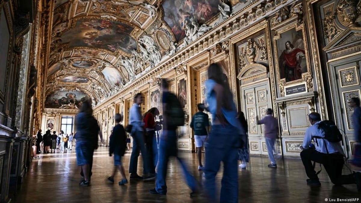 Ornate gilded ceiling and baroque architecture of the Louvre's Apollo Gallery in Paris