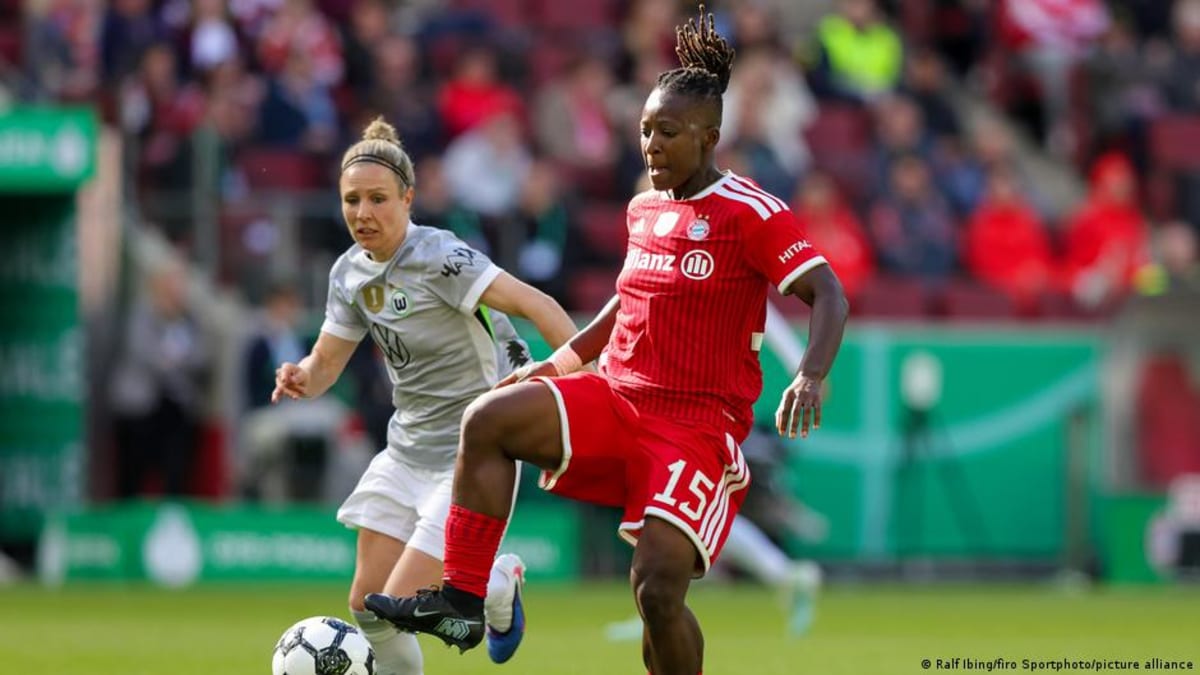 Bernadette Amani celebrating with trophy after winning title with Bayern Munich women's team