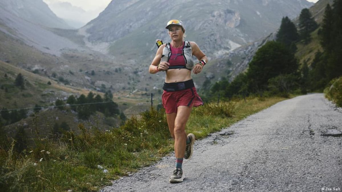 Sophie Woods running mountain trail during her record-breaking Via Alpina crossing