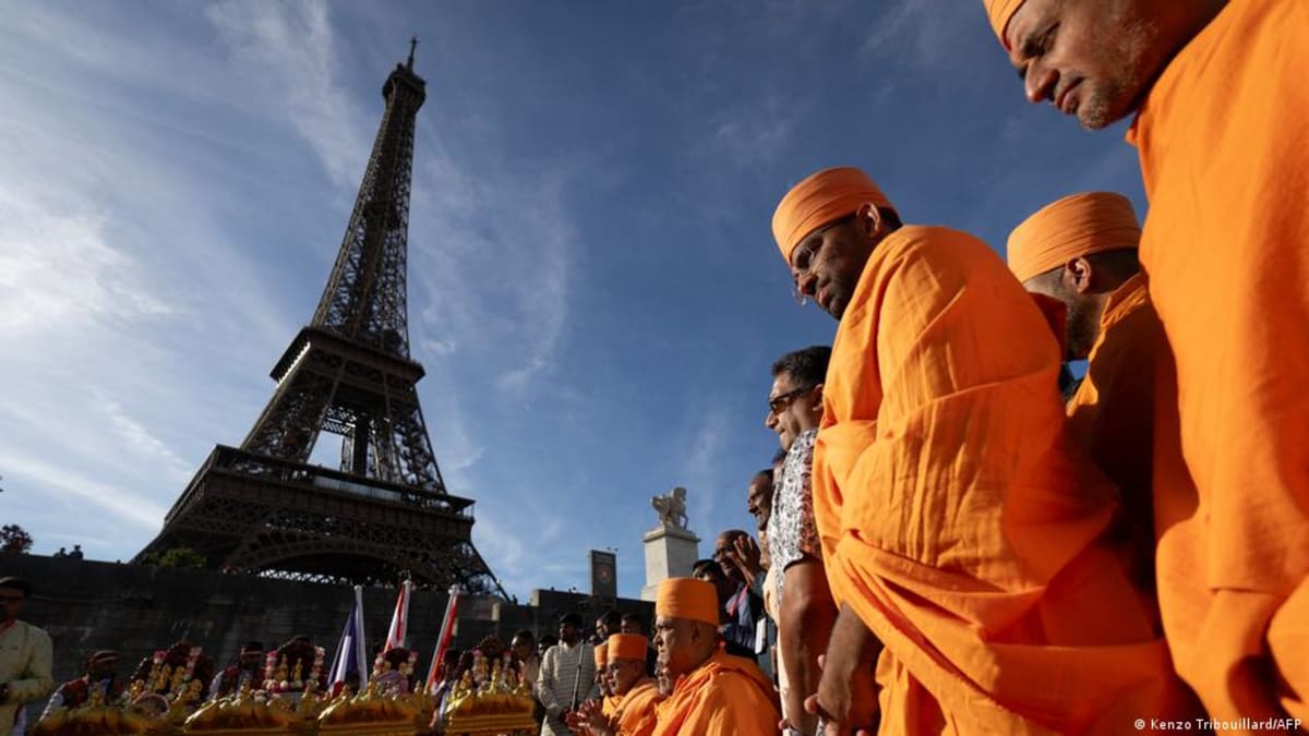 ** The Eiffel Tower in Paris stands against clear sky as iconic landmark