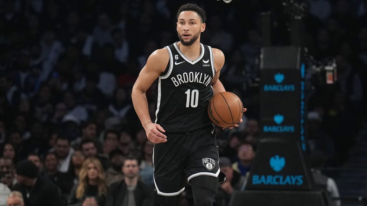 Ben Simmons holding fishing equipment on a boat during sport fishing championship competition