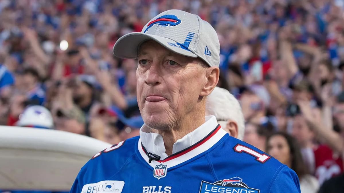 Jim Kelly in Buffalo Bills gear smiling at Highmark Stadium ribbon cutting ceremony