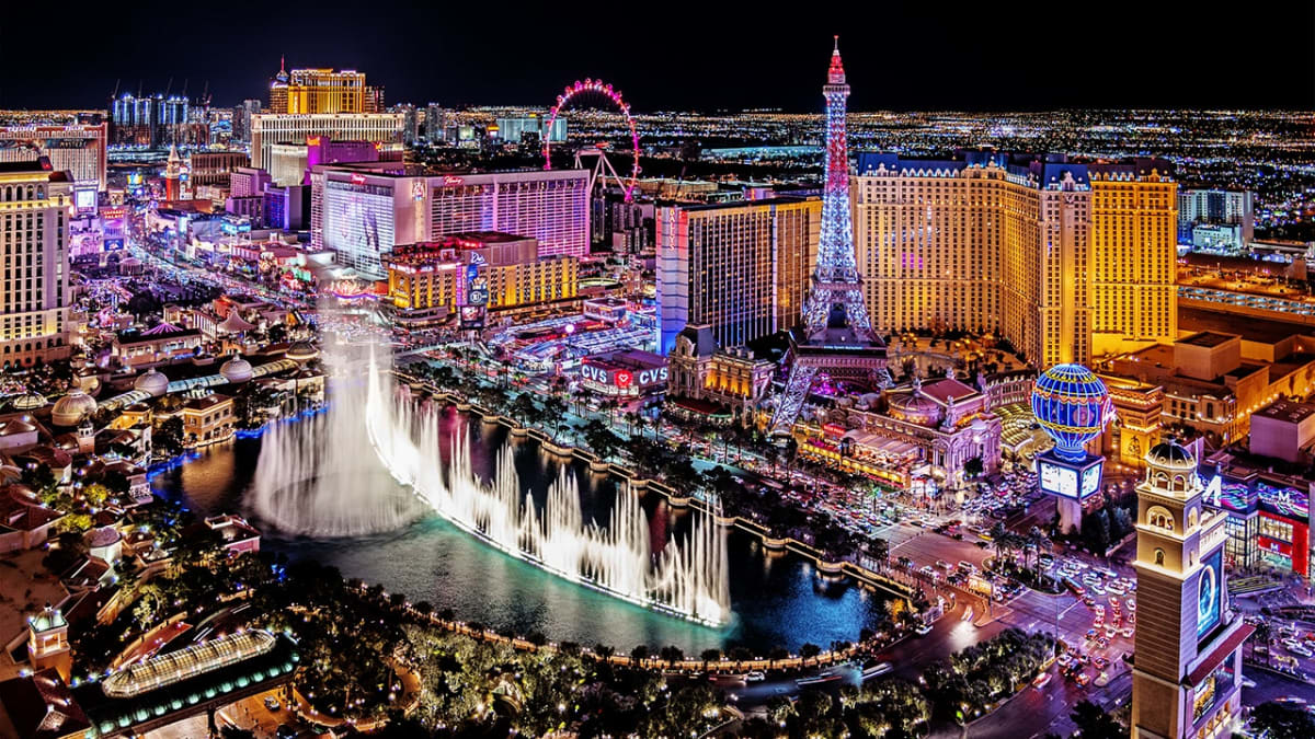 Illuminated heart-shaped hotel tower rendering on Las Vegas Strip at night