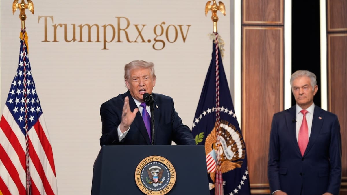 President Trump speaking at healthcare event with Dr. Mehmet Oz listening beside him