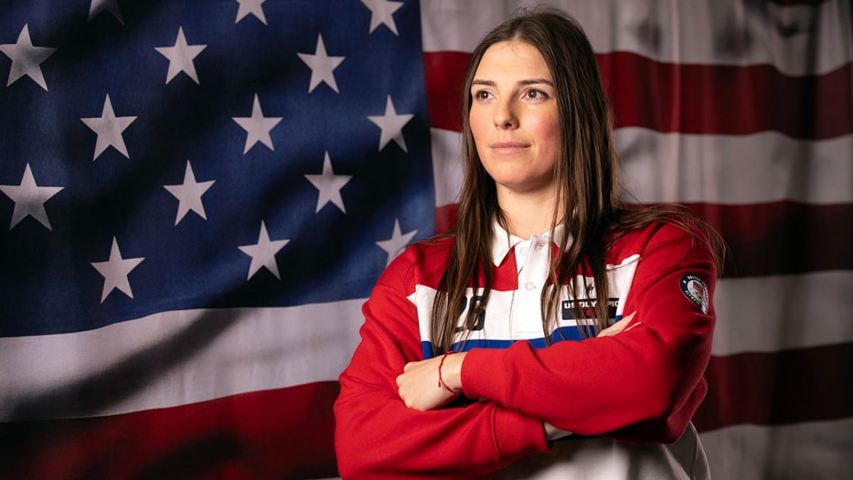 Olympic hockey captain Hilary Knight in Team USA uniform posing confidently at media event