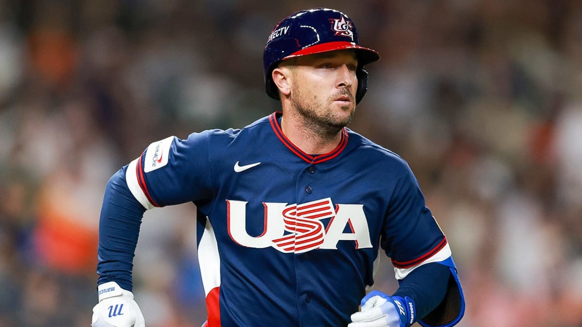 Alex Bregman in Team USA uniform running to first base during World Baseball Classic game