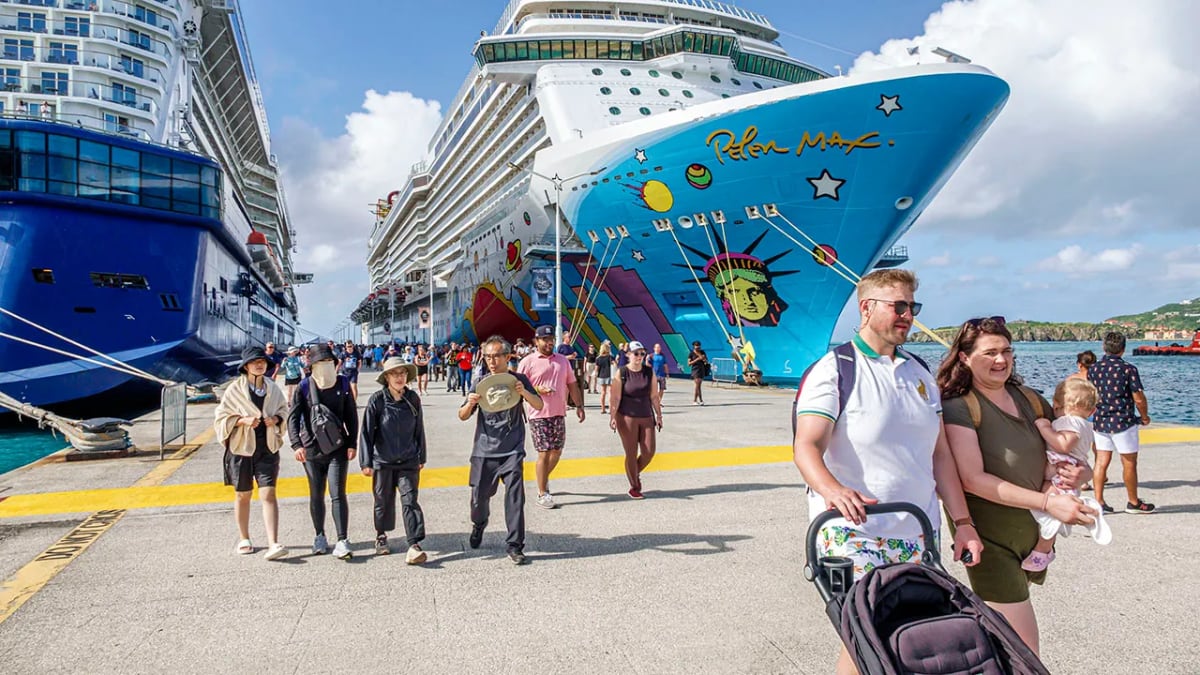 Spotless cruise ship deck with pristine railings and polished surfaces under clear blue sky