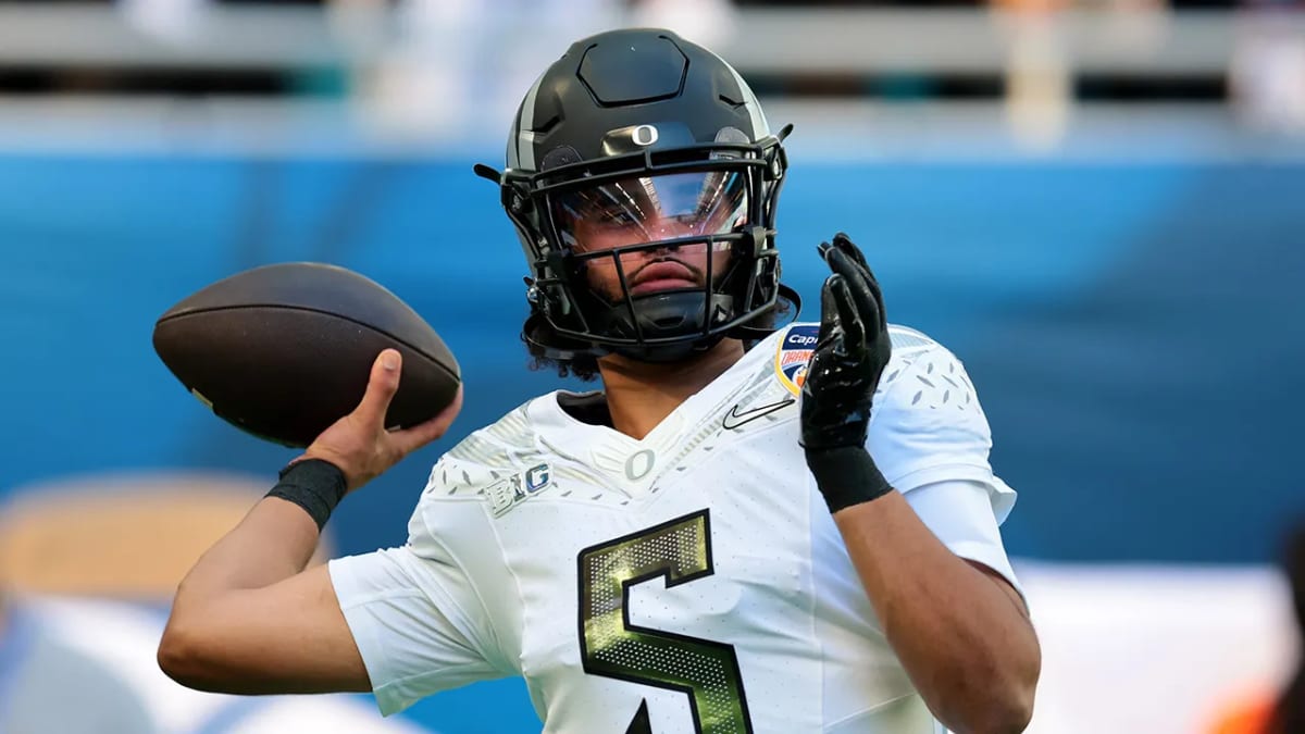 Oregon Ducks quarterback Dante Moore preparing to pass during college football game