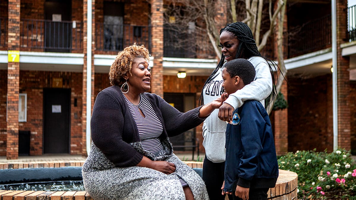 Social worker Ursula Newell-Davis standing confidently, advocating for special needs children in New Orleans community