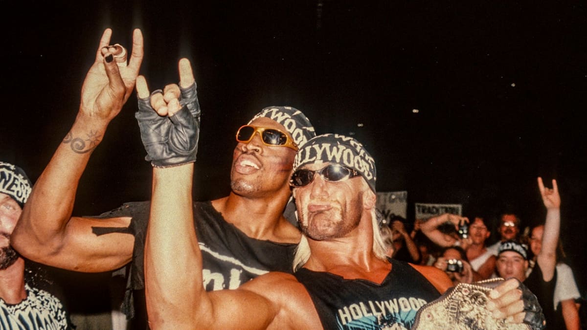 Dennis Rodman posing with Hulk Hogan in wrestling ring during 1990s WCW event