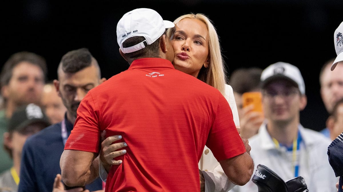 ** Vanessa Trump and Tiger Woods embracing at golf event in Palm Beach Gardens Florida