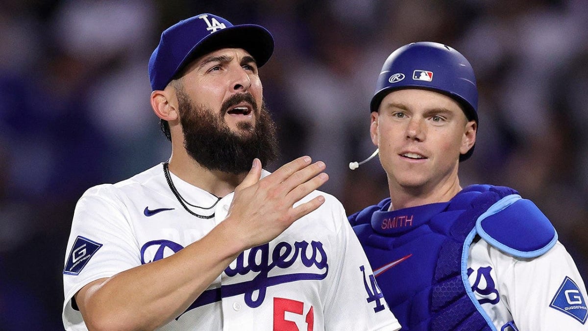 Dodgers pitcher Alex Vesia pointing to stands celebrating with healthcare workers after game