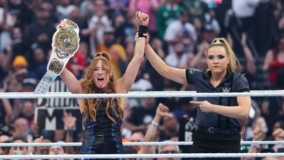 Becky Lynch celebrating with championship belt raised above her head at WrestleMania 42