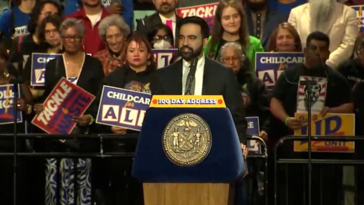 New York City Mayor Zohran Mamdani speaking at podium during 100-day celebration event