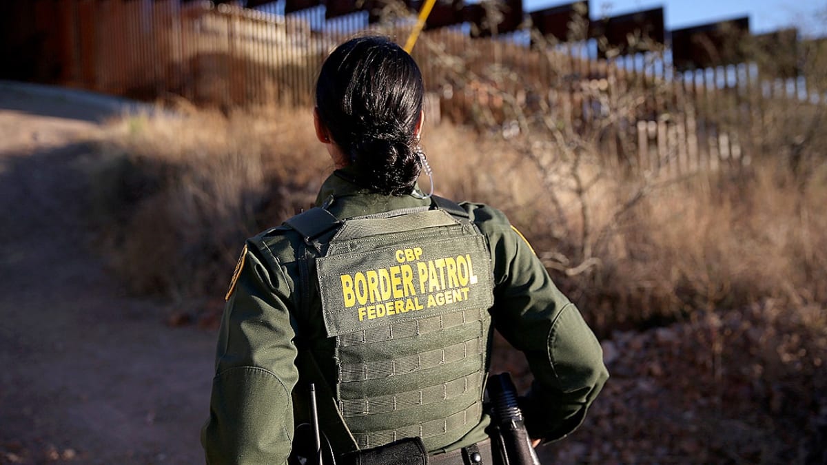 Customs and Border Protection officers inspecting packages of seized cocaine at Texas border facility