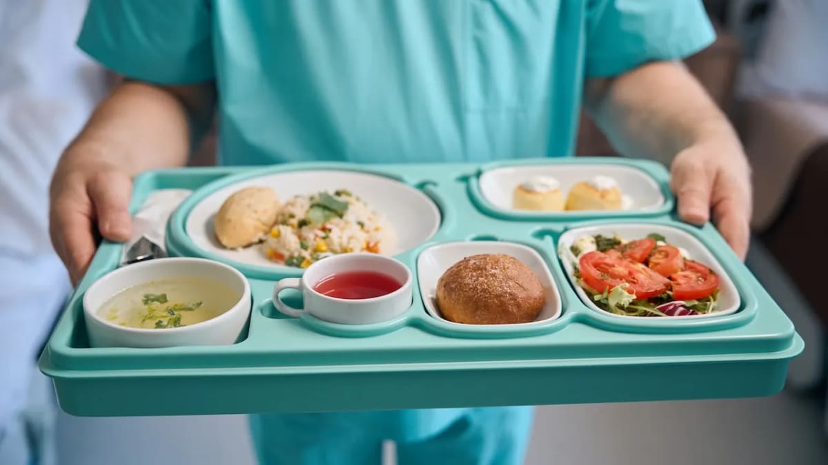 Fresh colorful vegetables and healthy proteins on hospital meal tray supporting patient recovery