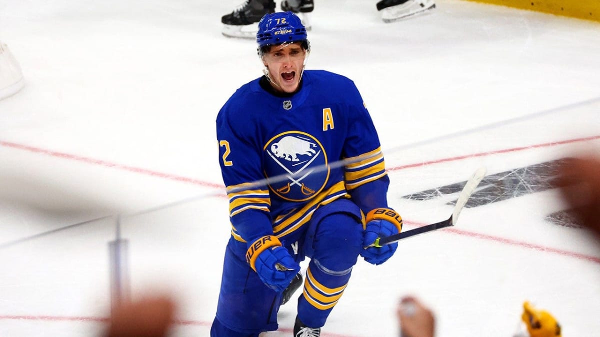 Hockey players celebrating goal during intense Stanley Cup playoff game action