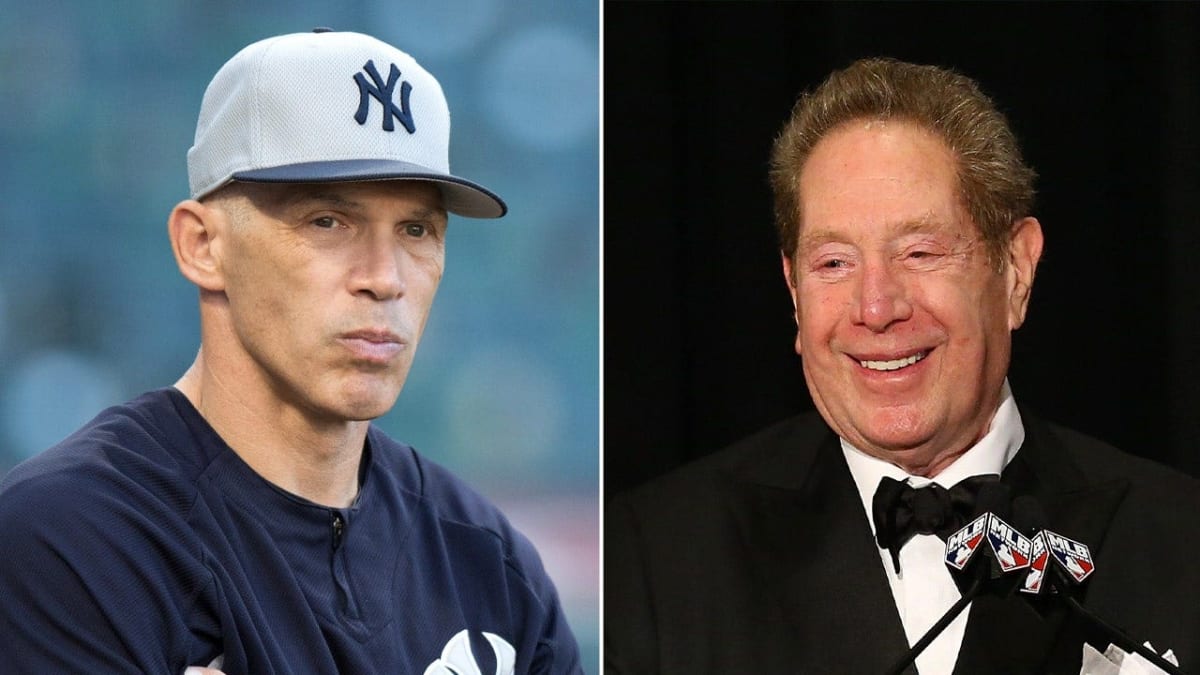 John Sterling sitting in Yankees radio broadcast booth smiling at Yankee Stadium