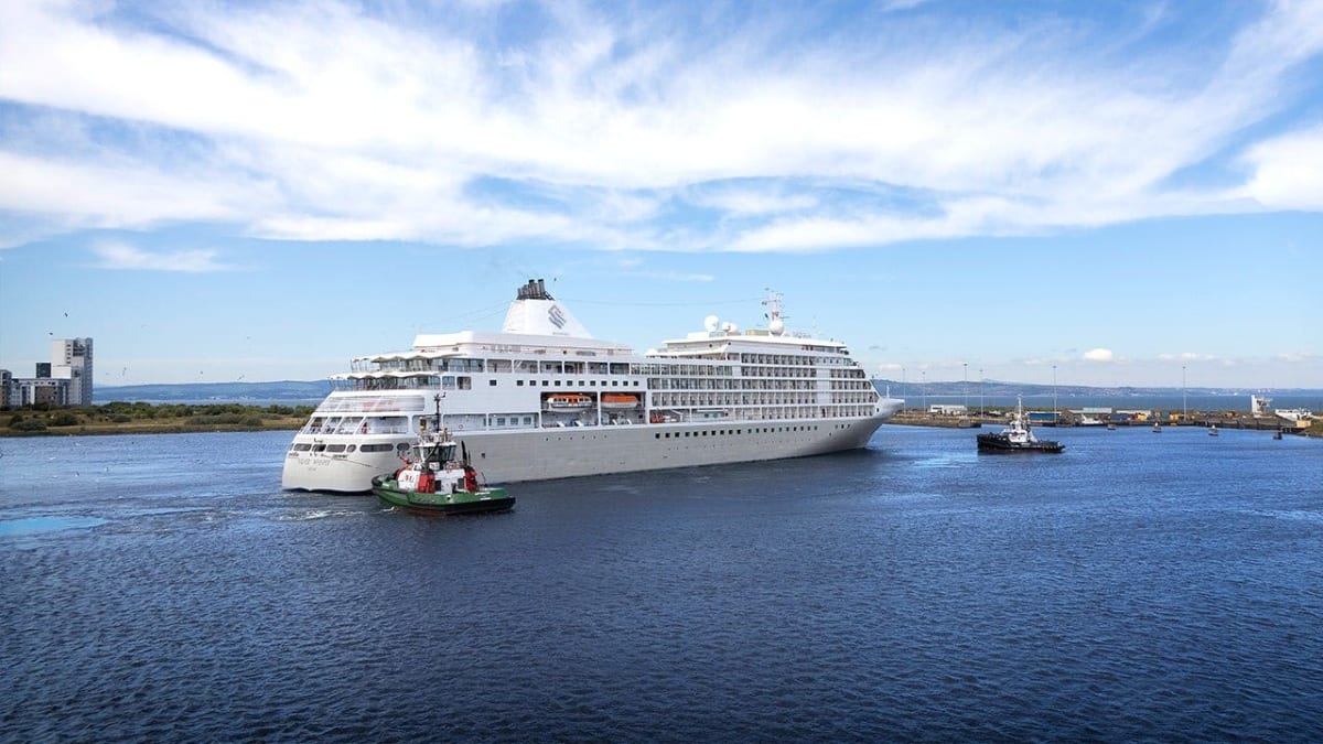 Luxury cruise ship Silver Whisper sailing through ocean waters during daytime