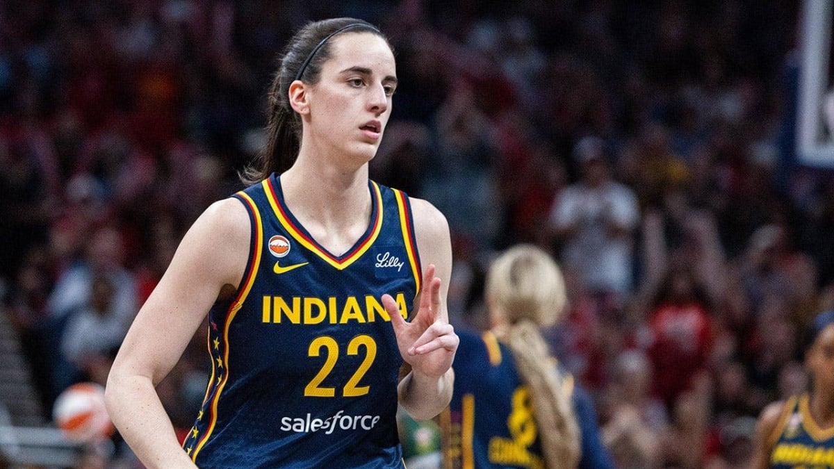 Caitlin Clark in Indiana Fever uniform playing basketball during WNBA game