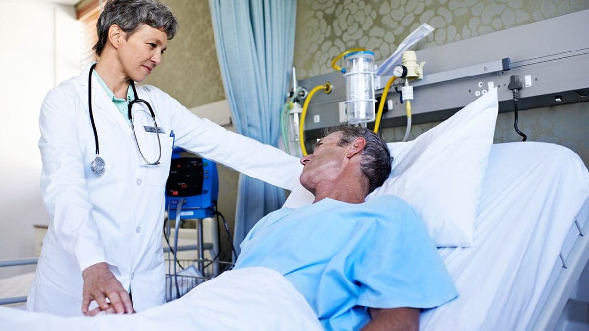 Medical researchers reviewing cancer treatment results showing positive patient outcomes and recovery progress
