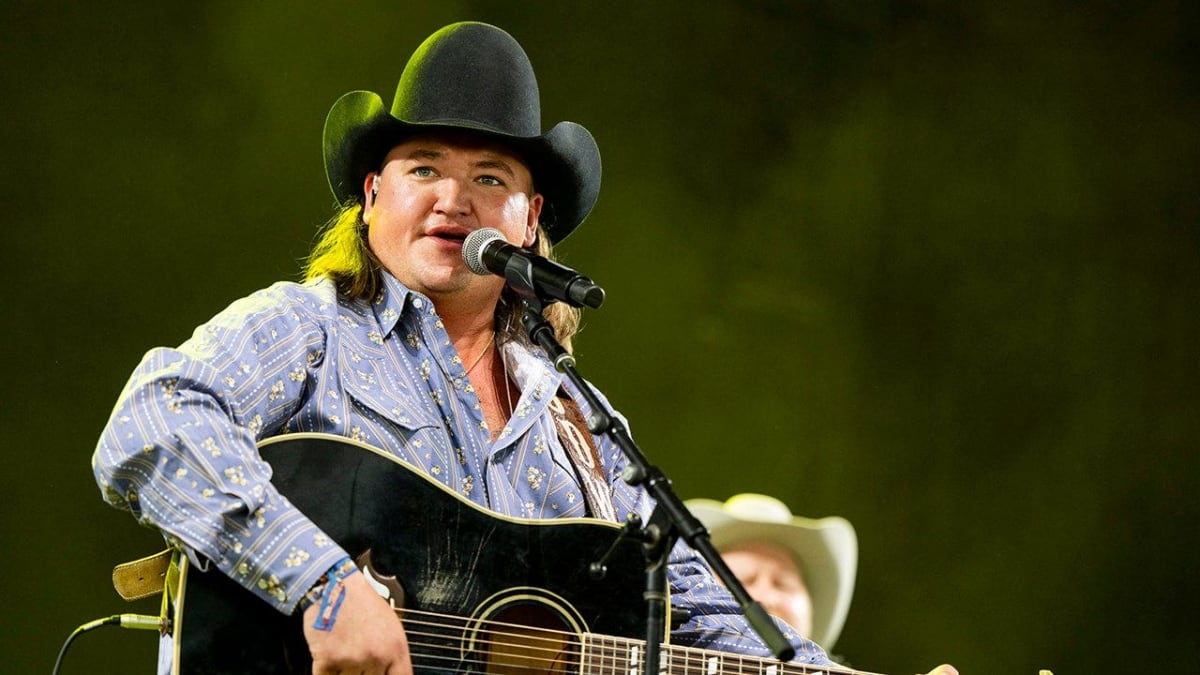 Country singer Jake Worthington performing on stage before announcing his music hiatus