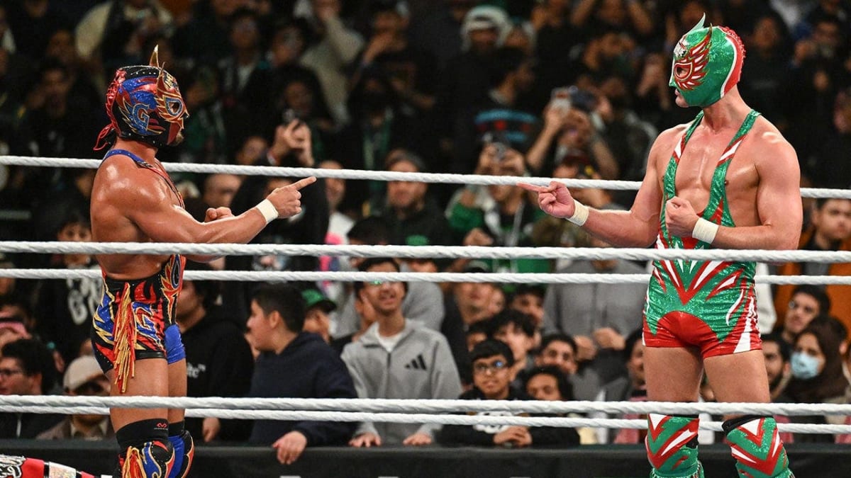 Two masked wrestlers facing off in ring before cheering crowd in Monterrey Mexico