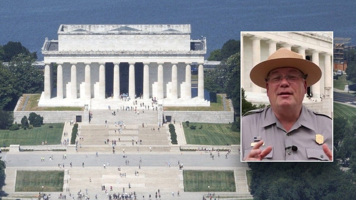 Glass-enclosed museum exhibits floating between massive concrete support pillars inside Lincoln Memorial Undercroft