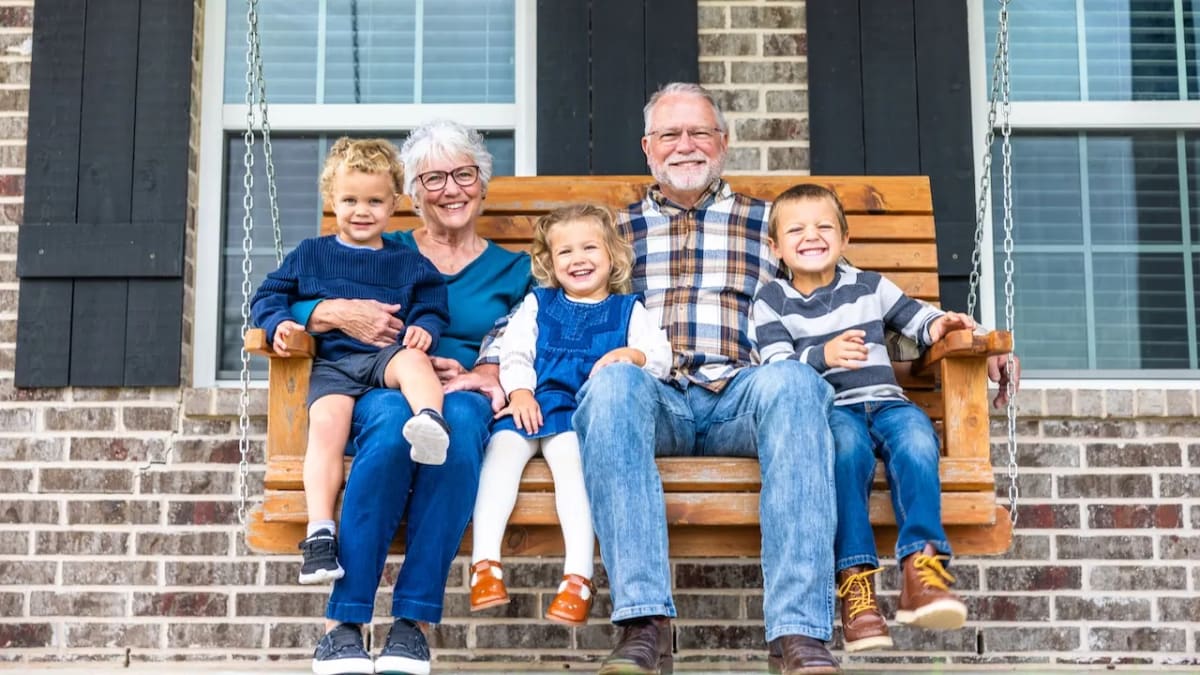 Multi-generational family smiling together, representing increased American life expectancy over centuries