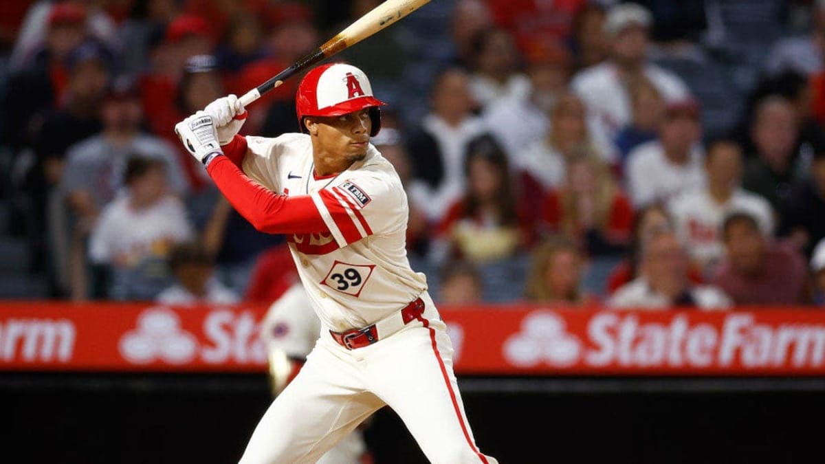 Jordyn Adams in baseball uniform catching a fly ball during spring training game