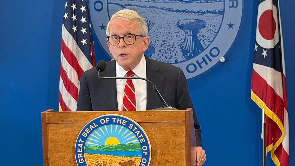 Ohio Governor Mike DeWine speaking at podium during news conference about death penalty policy