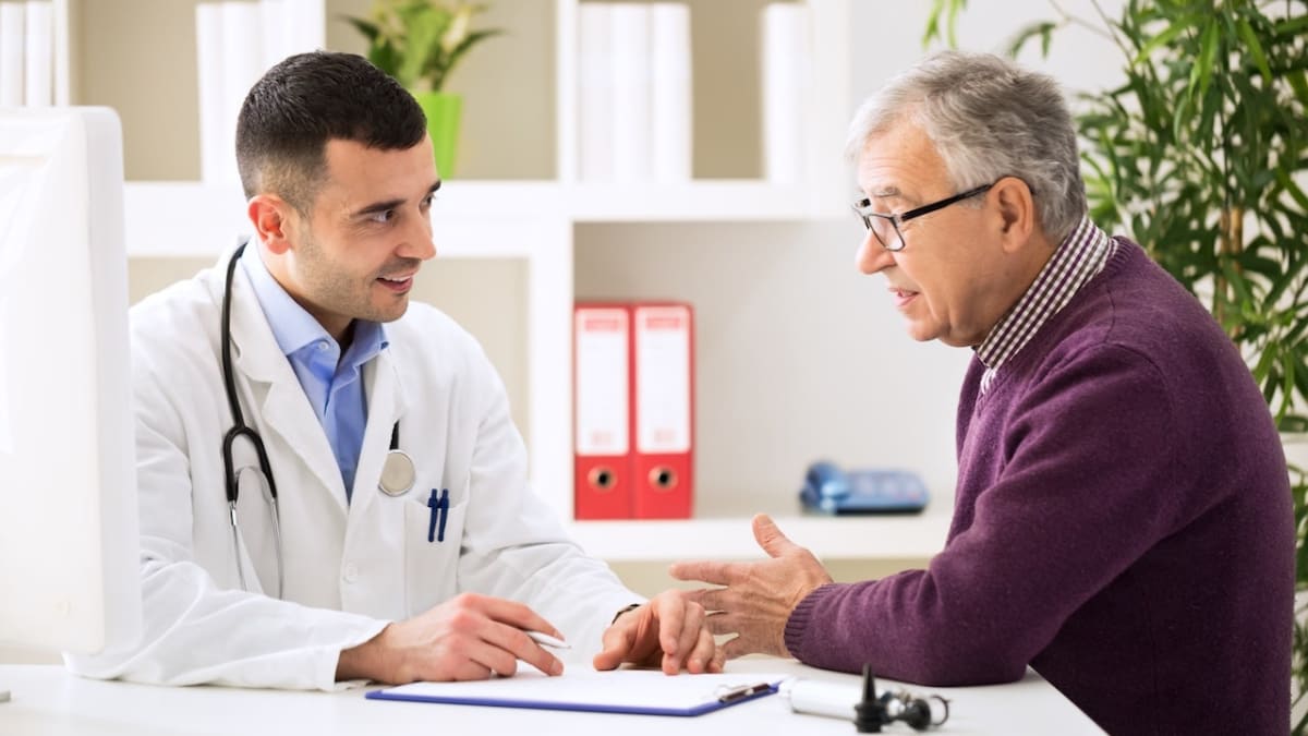 Medical professional drawing blood sample for advanced prostate cancer screening test in clinical setting