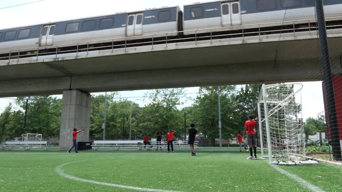 Young soccer players from Atlanta's Soccer in the Streets program practicing on urban field