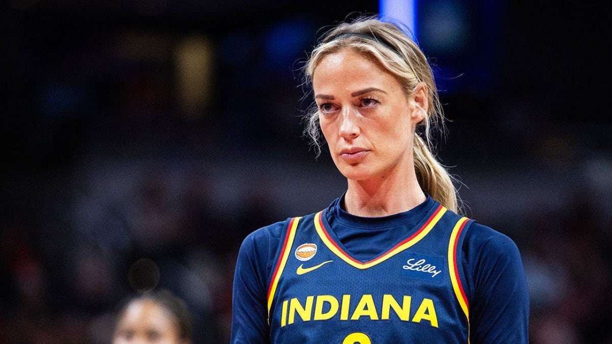 Indiana Fever guard Sophie Cunningham smiling on basketball court during WNBA game